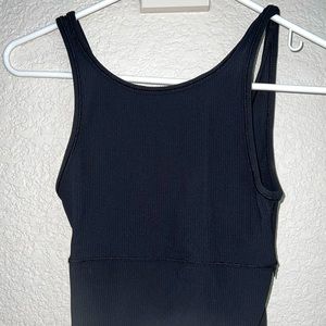 Lululemon power pivot black ribbed reversible tank. Never worn. Size 4.